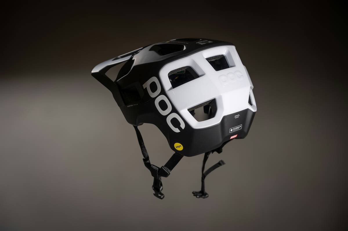 Climber wearing guard peak safety certified helmet on exposed ridge