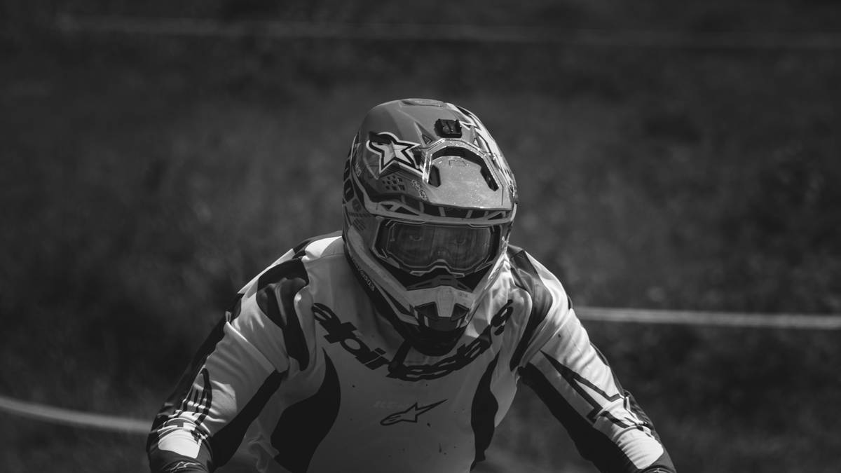 Climber wearing peak safety shield helmet during alpine ascent